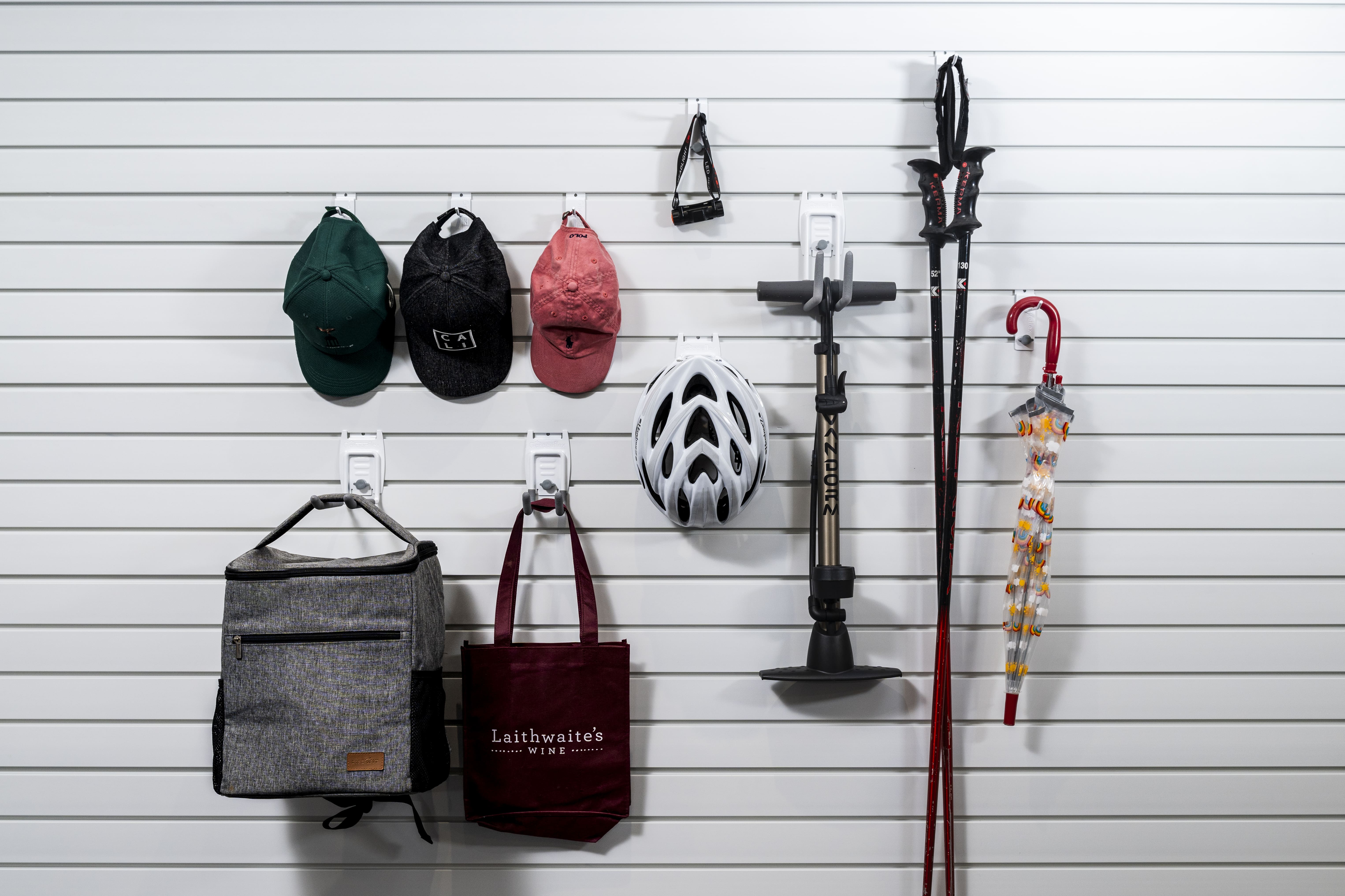 hats and bags being stored on garageflex hooks